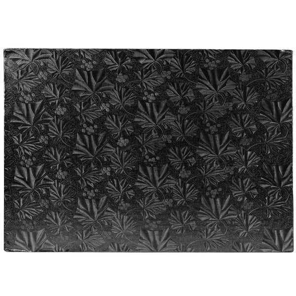 A white rectangular Enjay black cake board with a black pattern.