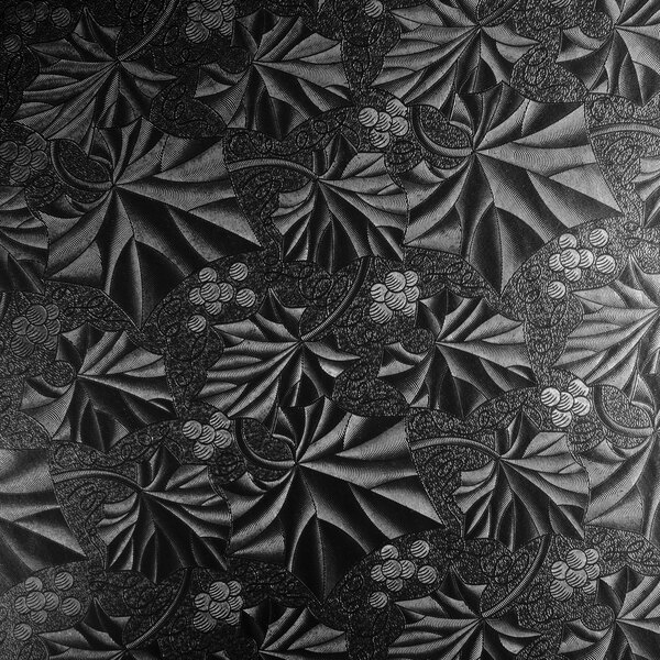 A black and white patterned Enjay round cake drum.