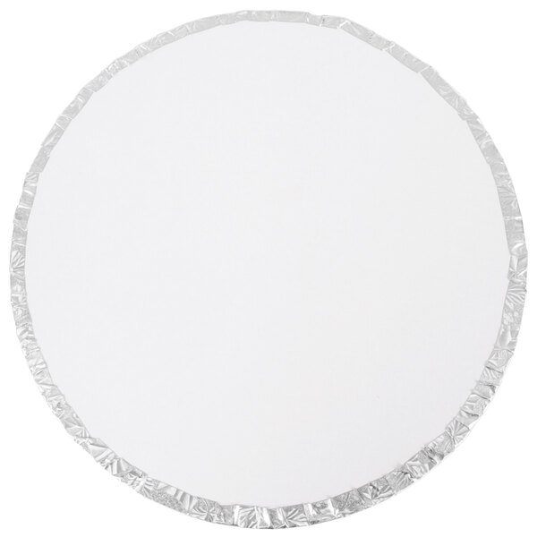 A white circle with silver foil around it.