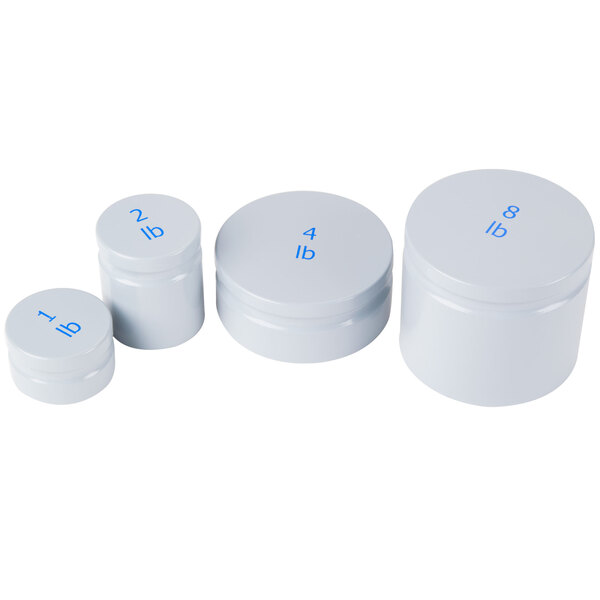 Three white plastic containers with blue writing on the front.