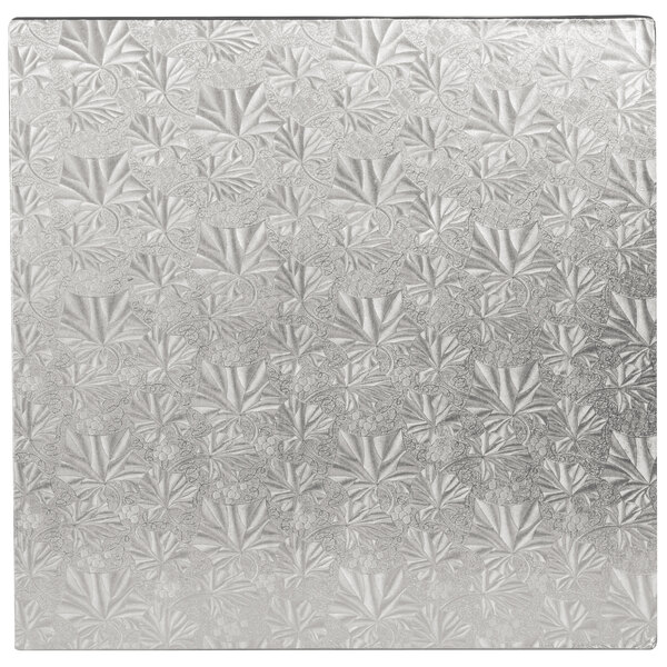 A close up of a silver Enjay square cake drum with a pattern on the edge.