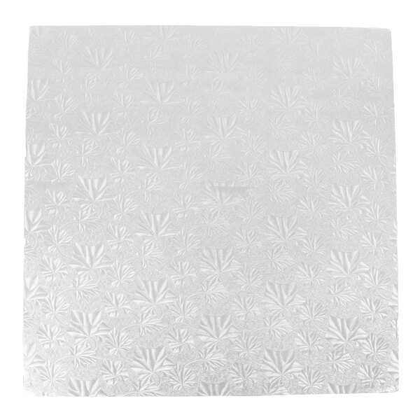 A white square Enjay cake drum with a pattern on it.