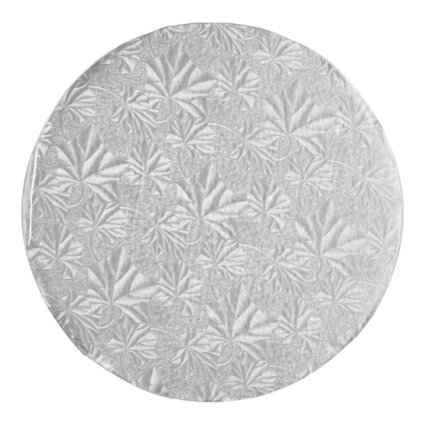 A round, silver cake drum with a textured leaf pattern, designed for supporting cakes.