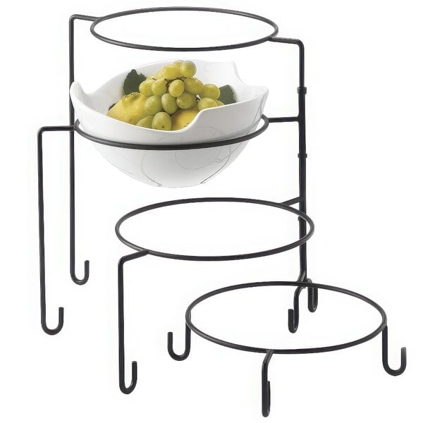 A Tablecraft 4 tier metal display stand with bowls of grapes and lemons.