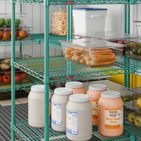A green wire shelf unit with multiple tiers, used for storage in commercial kitchens or pantries.