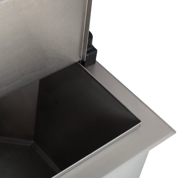 A close-up of a stainless steel Servend drop-in beverage dispenser with a lid.