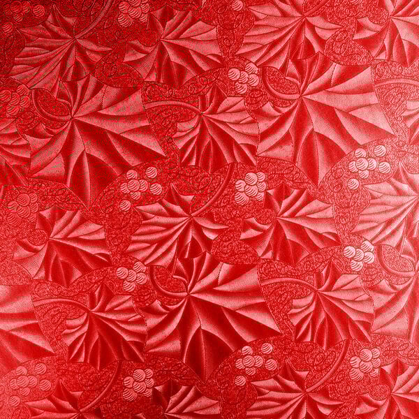 A white background with a red Enjay round cake drum.