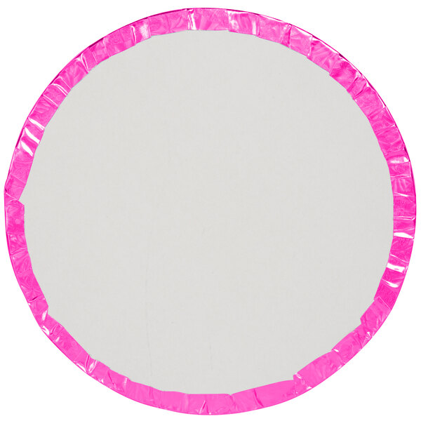 A white round cake drum with pink trim.