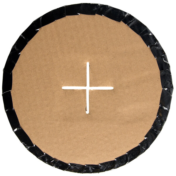 A white circular cardboard cupcake stand with a white cross on it.