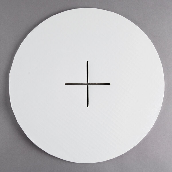 A white circle with a cross cut out of it.
