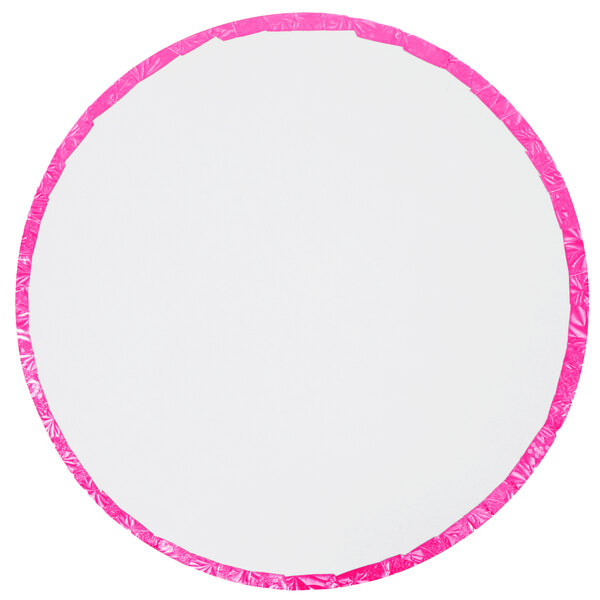A white round cake drum with a pink trim.