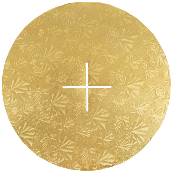 A circular gold plate with a cross on it.