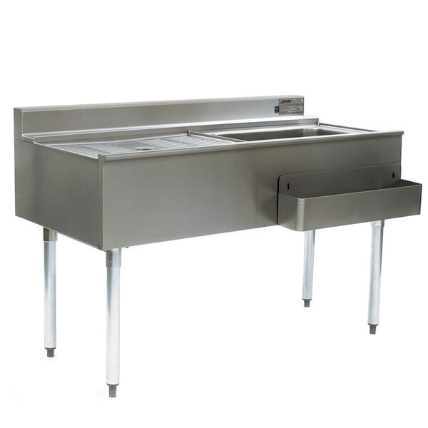 A stainless steel Eagle Group cocktail workstation with a right side ice bin and cold plate on a stand with a sink.