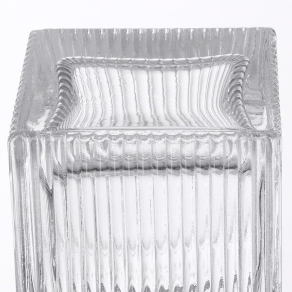 A clear glass square salt and pepper shaker set with a square base.