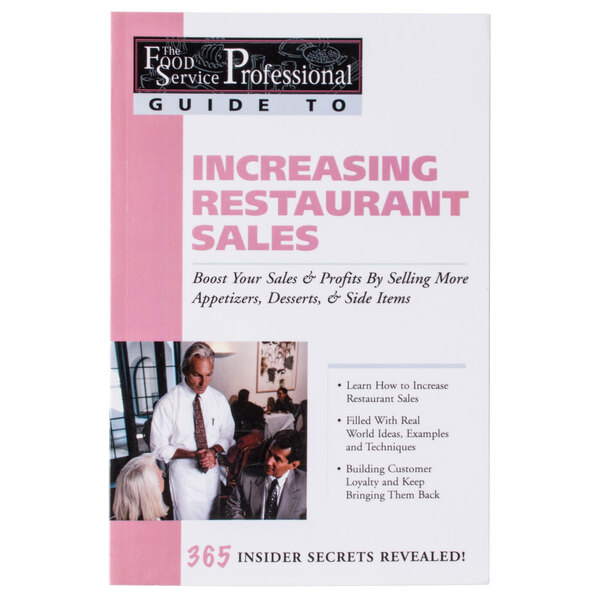 The book cover for Increasing Restaurant Sales on a counter in a restaurant.