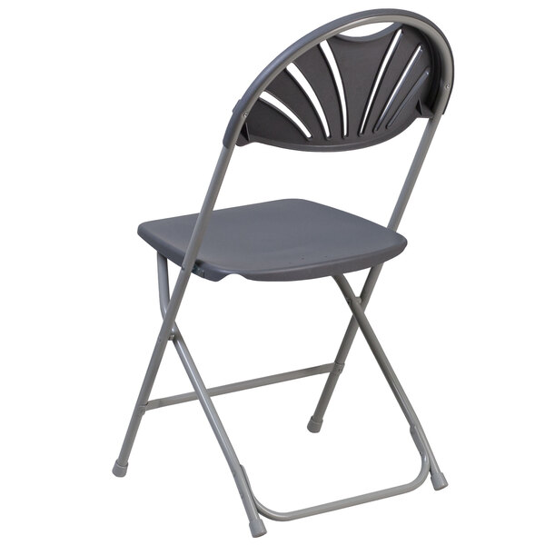 A black Flash Furniture folding chair with a fan back.