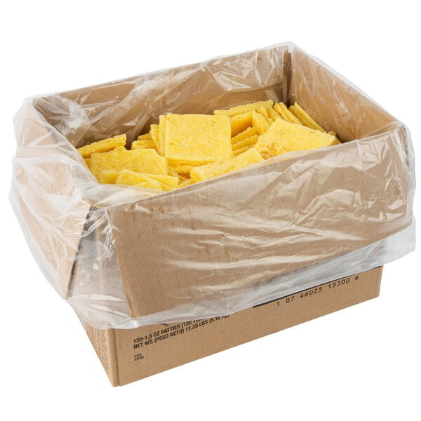 A box filled with yellow square scrambled egg patties.