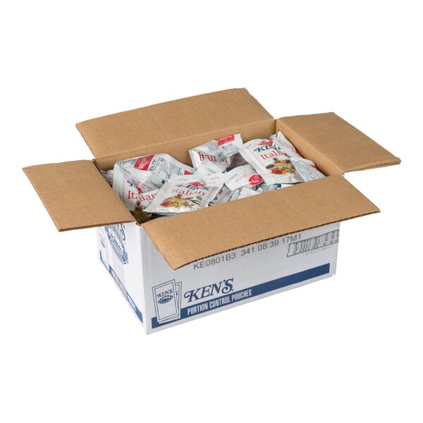 An open cardboard box containing multiple individual packets of Ken's Lite Italian Dressing.