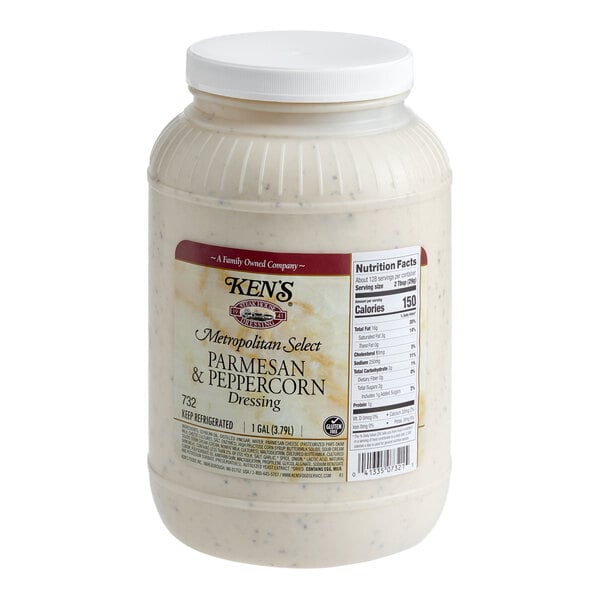 A 1-gallon plastic jar of Ken's Metropolitan Select Parmesan & Peppercorn Dressing.