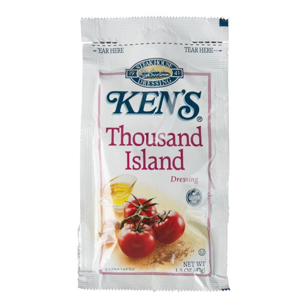 A single-serve packet of Ken's Thousand Island Dressing featuring images of tomatoes and a small container of dressing on the front.