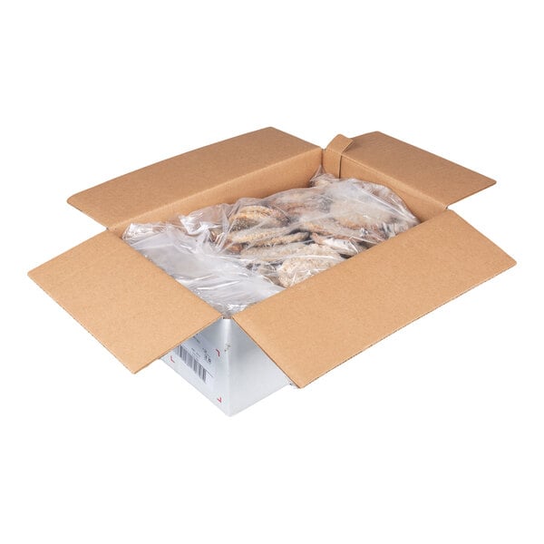 A box of fully cooked pork sausage patties in a plastic liner.