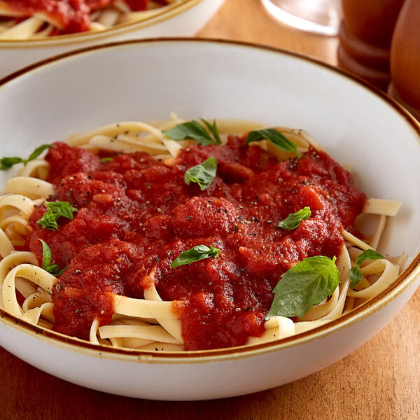 bowl of pasta with tomato pasta sauce on top