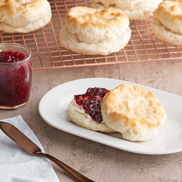 A plate of Pillsbury Southern Style biscuits with jam on the side.