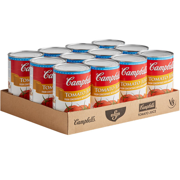 A group of 12 Campbell's Tomato Juice cans.