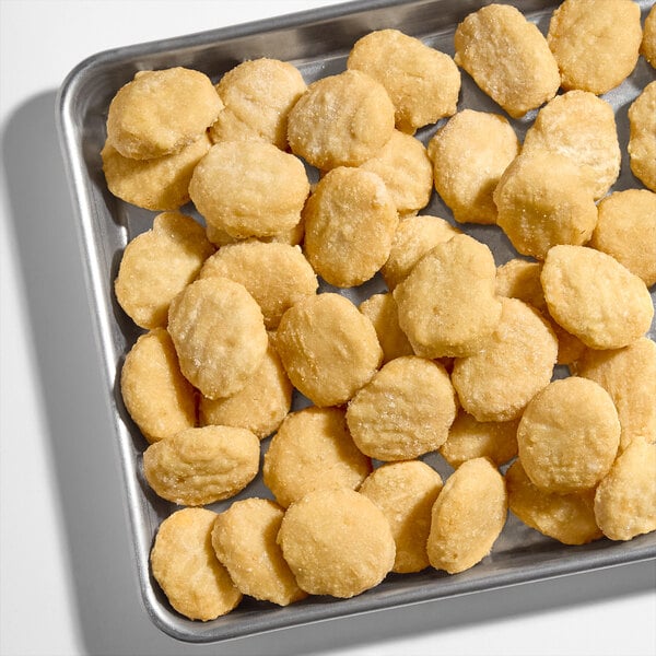 A tray filled with breaded mac and cheese bites.