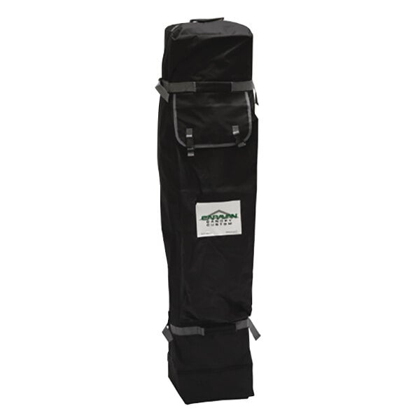 A black bag with grey straps and a white label with green text.