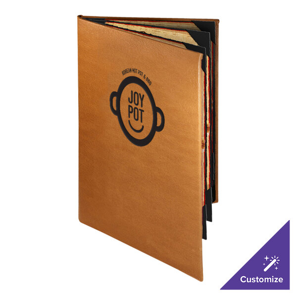A brown Menu Solutions Bella Collection leather menu cover with a black logo on a table.