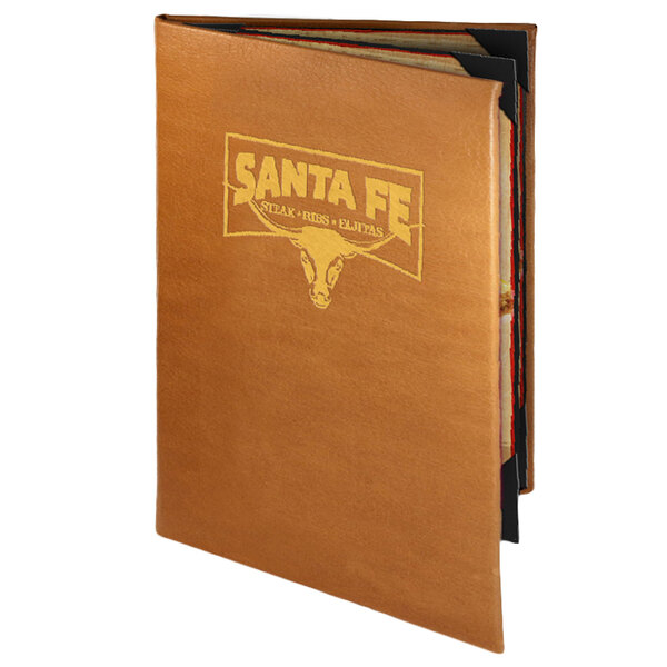 A brown leather Menu Solutions booklet cover with gold text on a table.