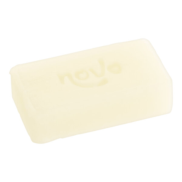A white rectangular Noble Eco Novo Natura soap bar wrapped in paper with writing on it.