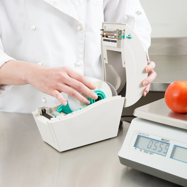 A Cardinal Detecto 30 lb. Digital Price Computing Scale with a thermal label printer.