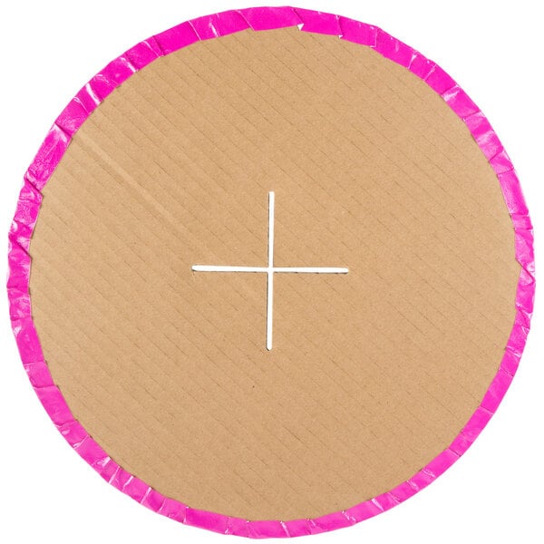 A circular cardboard cupcake stand with pink trim.