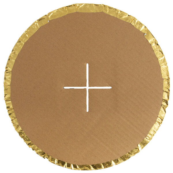 A white circular cardboard with a cross cut out of it.