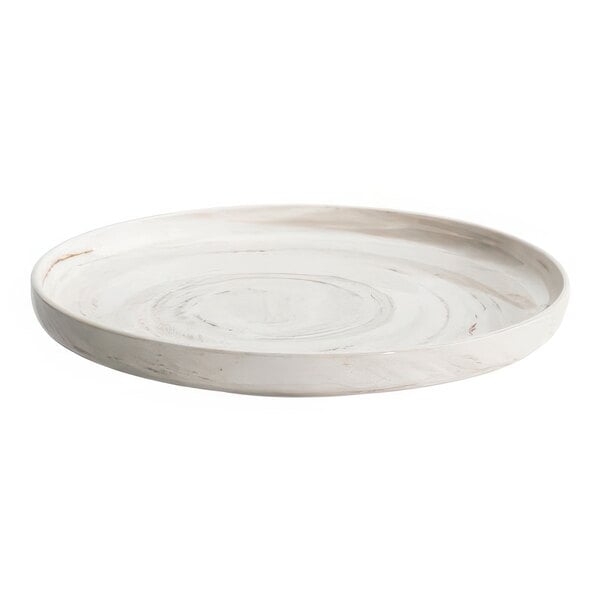 A white Luzerne Marble porcelain plate with a circular pattern.