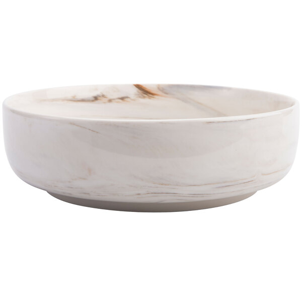 A white Oneida Marble porcelain bowl with brown veins.