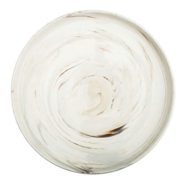 A white porcelain plate with brown swirly raised rim.