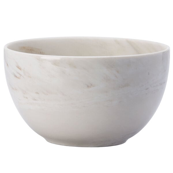 A white Oneida porcelain bowl with a marble pattern.