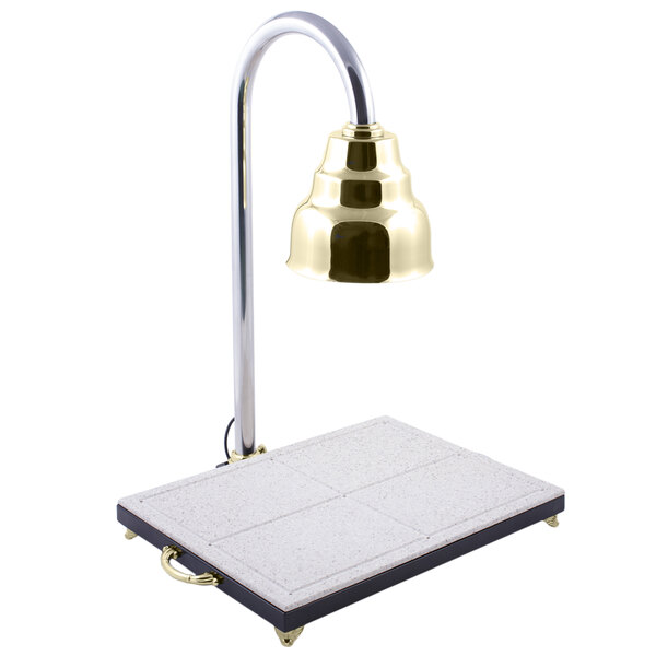 A Bon Chef brass lamp on a white surface.