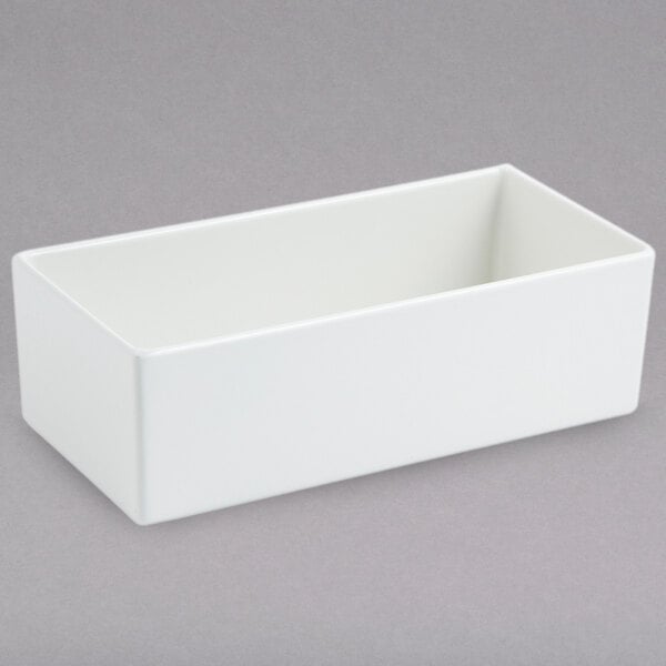 A white rectangular container on a gray surface.
