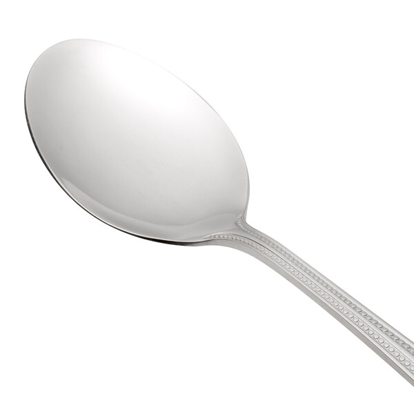 An Oneida Needlepoint stainless steel oval bowl soup/dessert spoon with a handle.