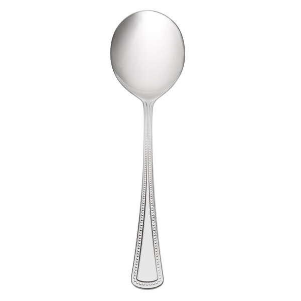 A Oneida Needlepoint stainless steel bouillon spoon with a beaded design on the handle.