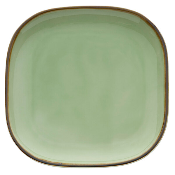 A square celadon porcelain plate with a brown edge.