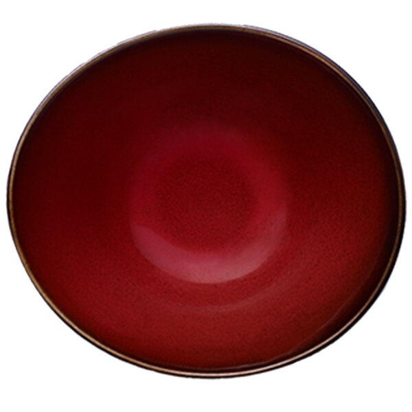 A close-up of a red bowl with a white interior.