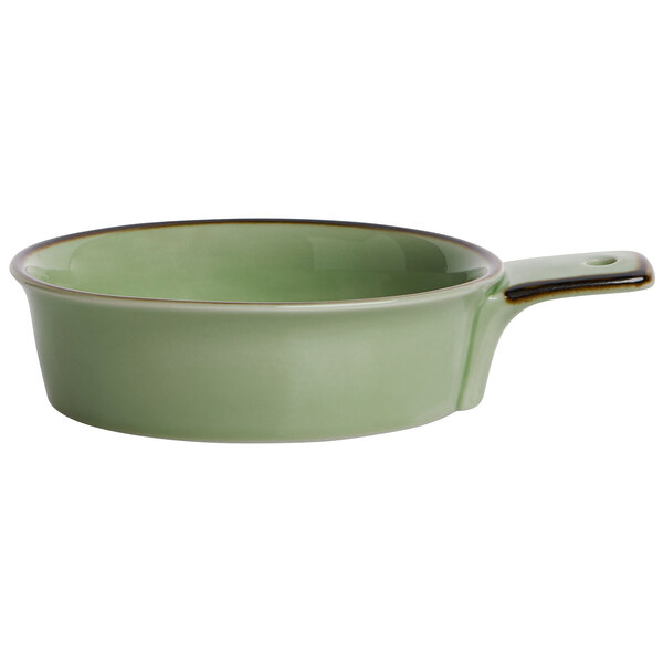 A Oneida Studio Pottery celadon porcelain single-handled tapas dish.