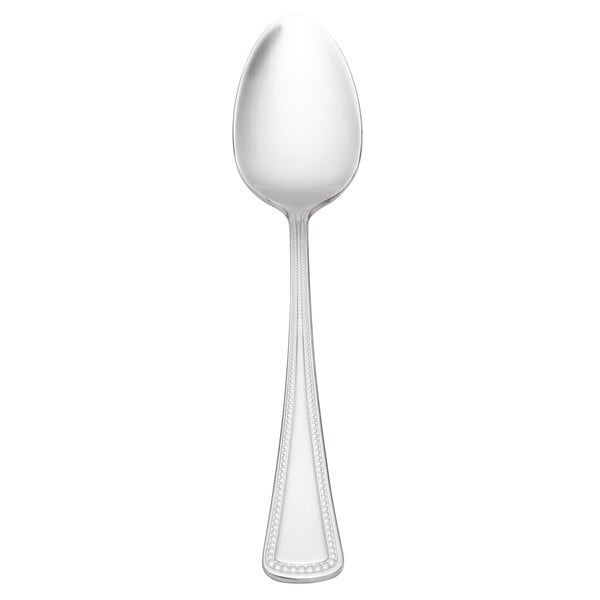A Oneida Needlepoint stainless steel teaspoon with a pointy design on the handle.
