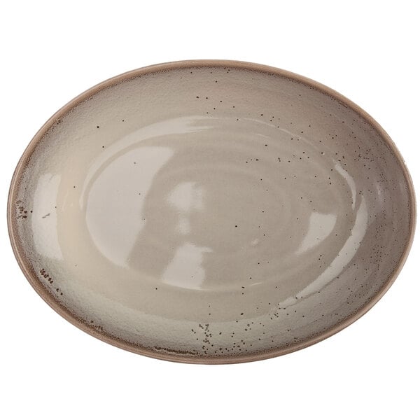 An Oneida Terra Verde Natural porcelain oval bowl with brown speckled design.