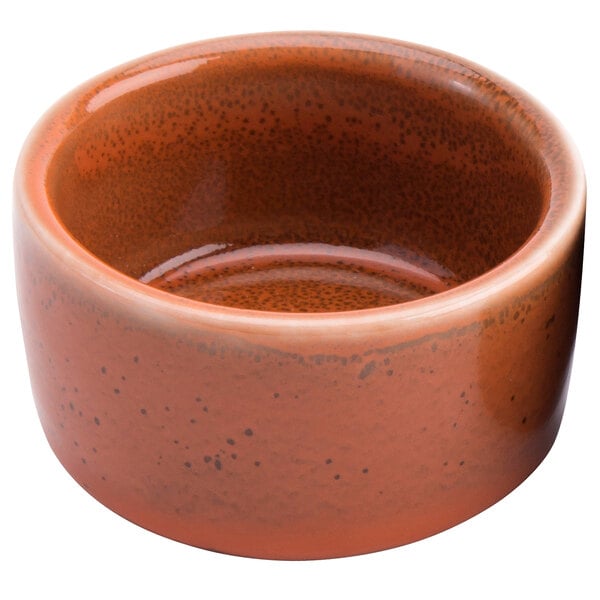 A close-up of a brown Terra Verde Cotta ramekin with a brown rim.